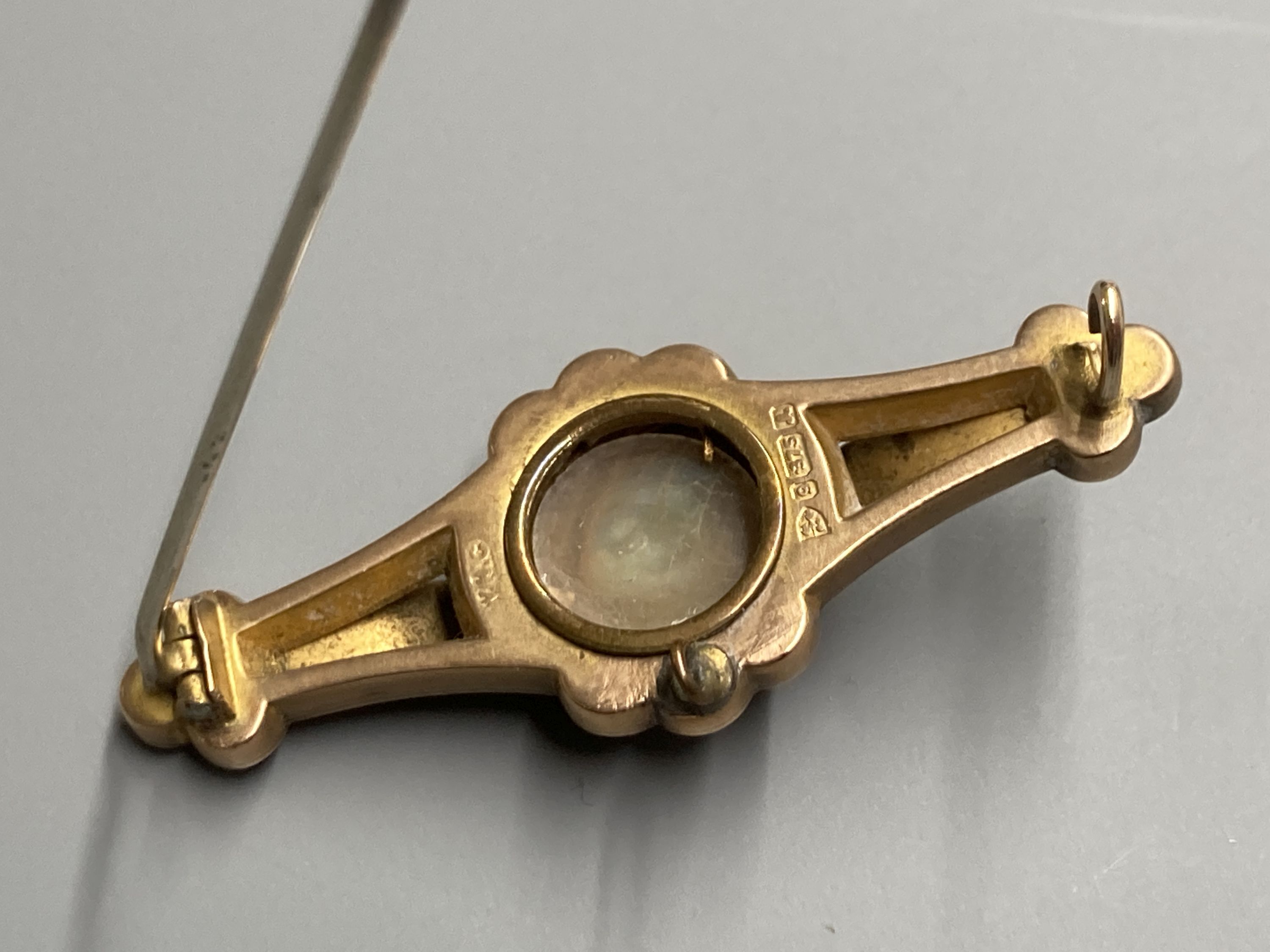 An Edwardian 9ct gold and gem set bar brooch, 47mm, gross 4.1 grams